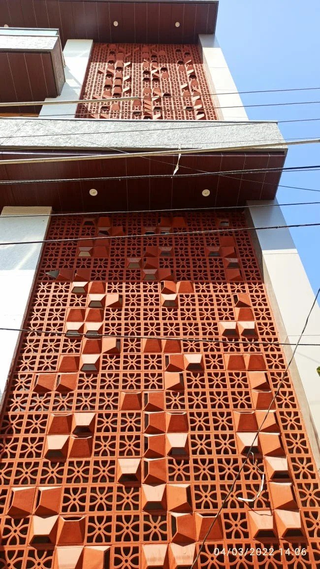 High-Rise Terracotta Jali Solar Screen